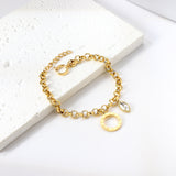 Círculo números arábigos + ojo diamante blanco complementos pulsera 18+3cm oro