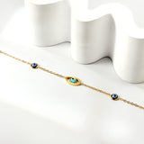 2 blue eyes + 1 lake blue eye anklet 22+5cm gold color