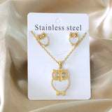 Gold/steel owl with diamonds on surface + shells glued on body jewelry set