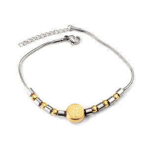 Bracelet rond en or avec breloque portrait 