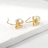 Boucles d'oreilles noeud + perle blanche Or 18 carats