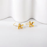 Bow + white pearl earrings 18k gold