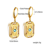 Aretes rectangulares con circonitas azules en oro de 18k