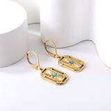 Aretes rectangulares con circonitas azules en oro de 18k