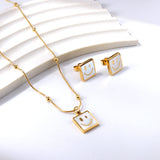 Square White Shell with Smiley Face Set Steel/Gold