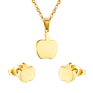 Gold/steel colored cut jewelry set with a golden apple on the cutting process