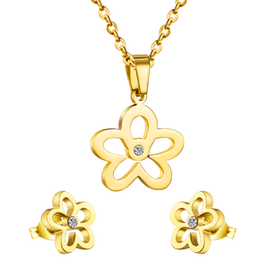 Gold/steel faceted cut jewelry set with diamonds in the center of a wispy flower