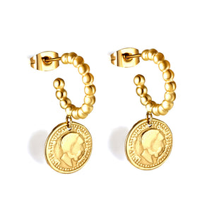 Boucles d'oreilles tête d'homme perles acier demi rondes avec gâteau rond