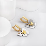 Gold coloured U-shaped ear clips with graduated gold sized butterfly studs