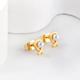 Pendientes talla pez con perlas blancas