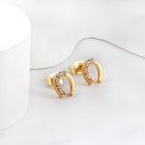 Gold U-shaped cut earrings with diamonds