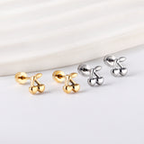 Gold coloured screw-in cherry stud earrings