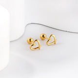 Gold coloured steel beads and screws heart cut-out earrings