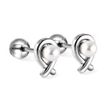 Gold coloured steel ball screw back fish shaped stud earrings with white pearls