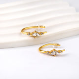 Gold coloured U-shaped stud earrings with white diamonds