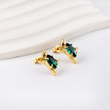 Gold coloured four-pointed star with green diamonds stud earrings