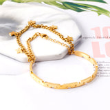 Hard bangle in gold color with end chain & star accessory