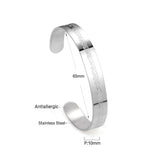 Extra wide hard open bangle in steel color with engraved surface