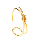 Hard bangle with minimalist clasp shape in gold color