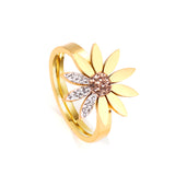 A large chrysanthemum with three leaves set with diamonds ring