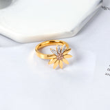 A large chrysanthemum with three leaves set with diamonds ring