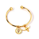 Hard bracelet with hand held flower and butterfly charms