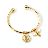 Hard bracelet with butterfly and flower charms