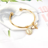 Hard bracelet with butterfly and flower charms