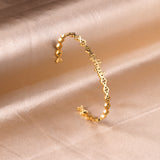 Angeb monogrammed gold colored hard bracelet