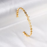 Angeb monogrammed gold colored hard bracelet