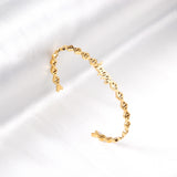 Happy monogrammed gold colored hard bracelet