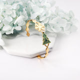 Golden green tree hard bracelet