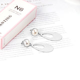 Half Pearl Glossy Oval Earrings