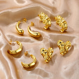 C-shaped earrings with cast rolled edges and irregularly shaped surfaces