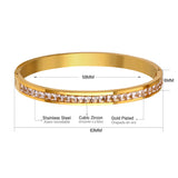 Gold-tone hard bracelet with a circle of diamonds in the center