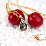 Gold/Steel Oval Black Flower Stone Jewelry Set