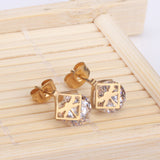 Gold/steel set with zirconia + two wispy dragonfly shapes wrapped in squares