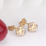 Gold/steel set with zirconia + two wispy dragonfly shapes wrapped in squares