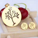 Gold/steel jewelry set with a beautiful tree look realized by cutting process