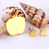 Gold/steel colored cut jewelry set with a golden apple on the cutting process