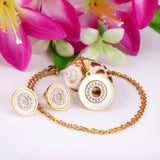 Gold/steel color white shells set with diamonds on top of circle with diamonds jewelry set