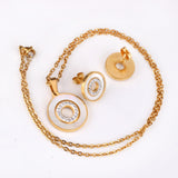 Gold/steel color white shells set with diamonds on top of circle with diamonds jewelry set