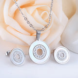 Gold/steel color white shells set with diamonds on top of circle with diamonds jewelry set