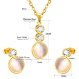 Gold/steel color sticking cat's eye stones + two small round cakes topped with diamonds jewelry set