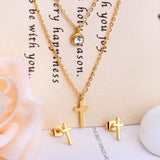 Steel/gold double chain pendant jewelry set with diamonds in the shape of a polished cross + diamonds on one chain