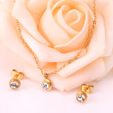 Gold/steel round jewelry set with diamond in the center