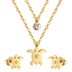 Gold/steel double chain pendant jewelry set in the shape of a small sea turtle with diamonds