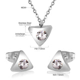 Gold/steel triangle jewelry set with diamond in the center