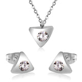 Gold/steel triangle jewelry set with diamond in the center