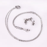 Gold/Steel Music Note Cut Jewelry Set with Diamonds